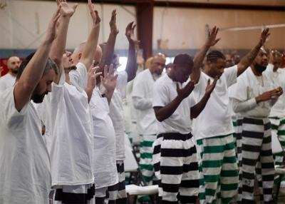 Inmates praising